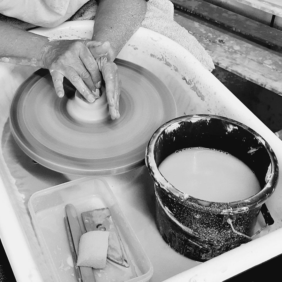Potter at work at his pottery wheel